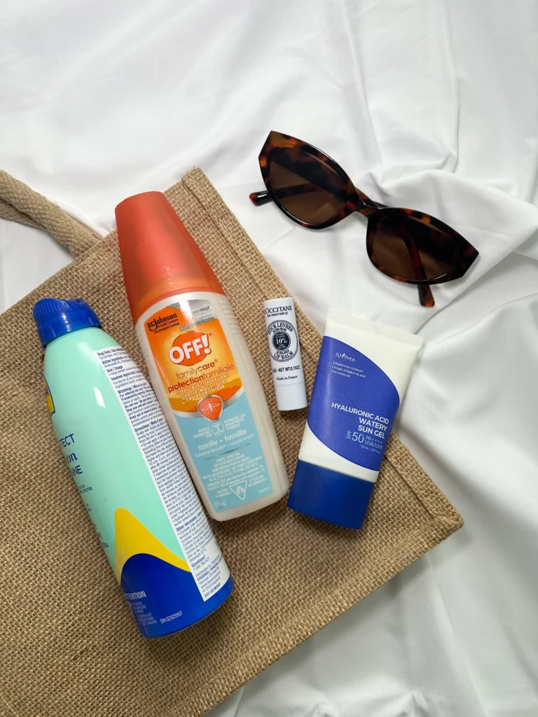 beach bag packed with essentials like sunscreen, sunglasses, and a towel