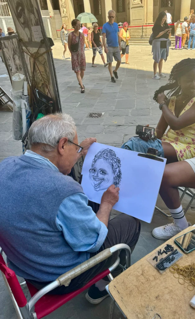 Caricature artist sketching in Florence, Italy